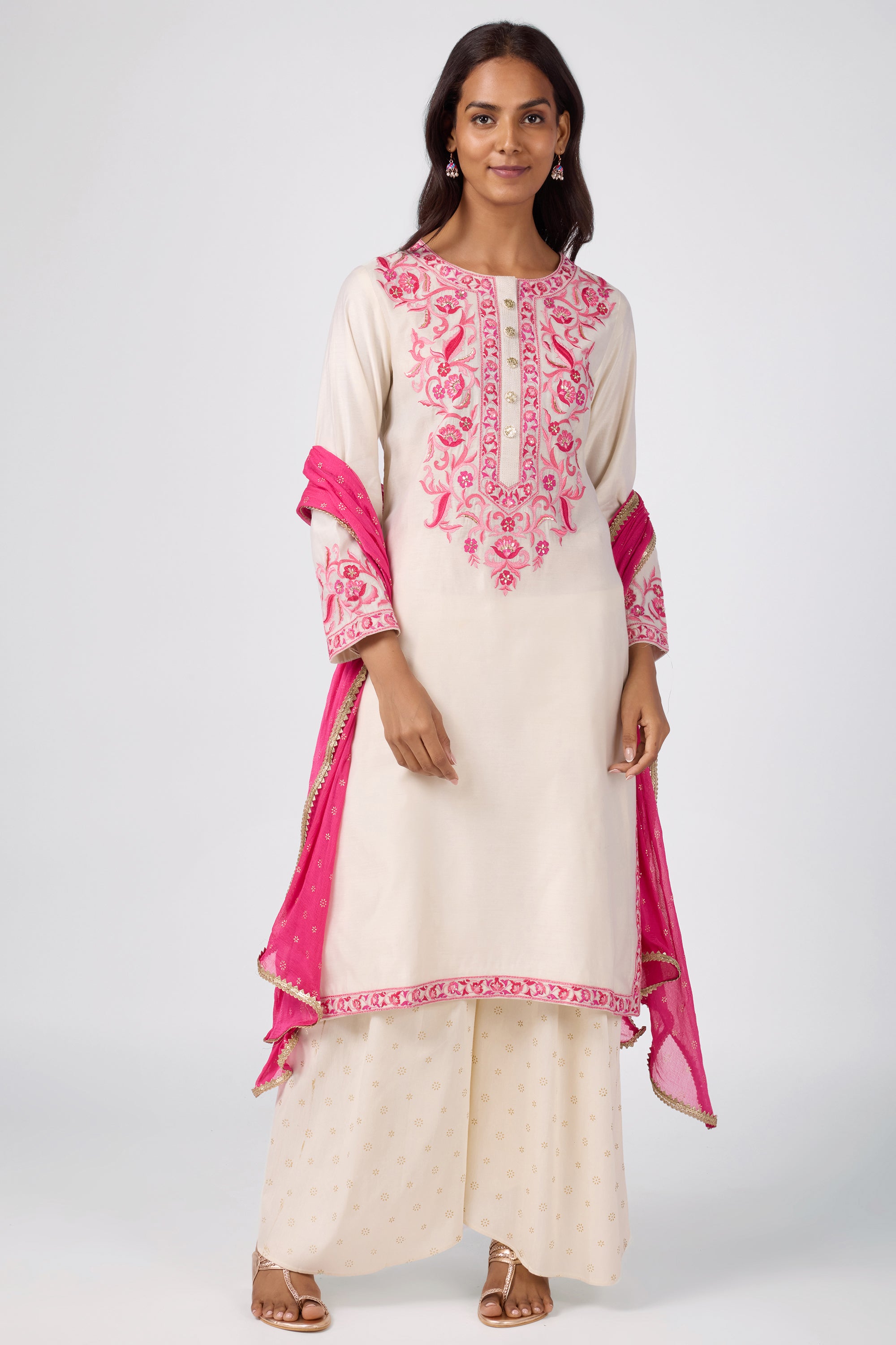 A-line kurta with embroidered yoke, paired with printed bottom and dupatta.