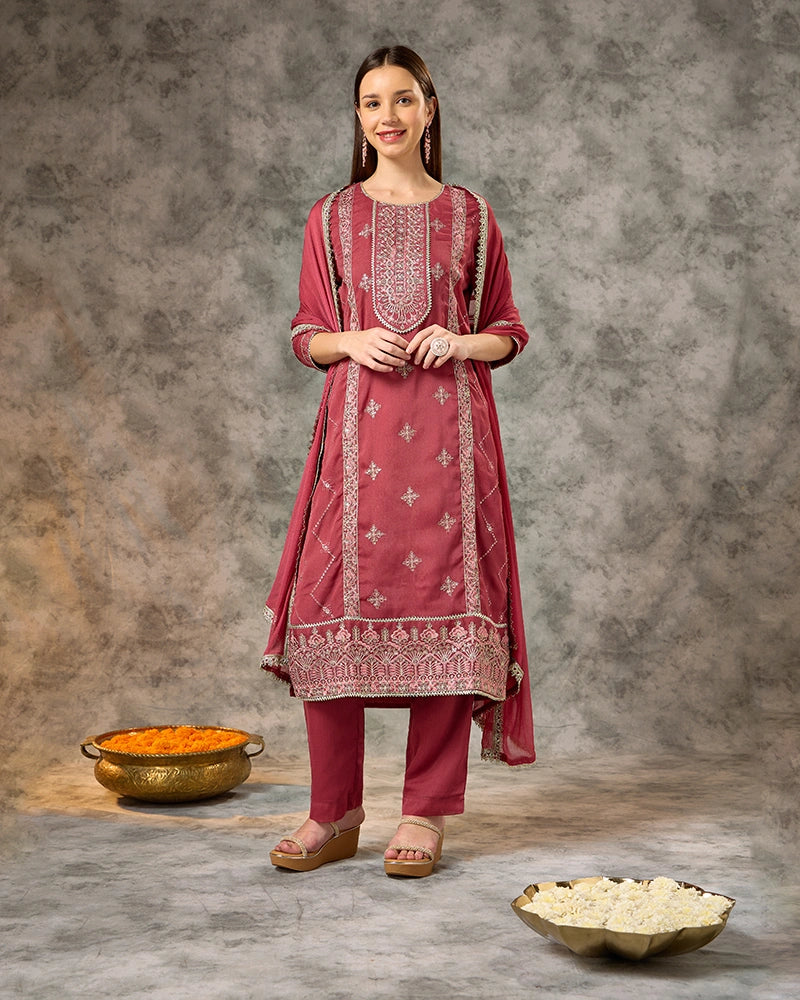 All-over zari embroidered knee-length straight kurta with 3/4 sleeves, paired with flared pants and a solid dupatta finished with lace detailing. New 1