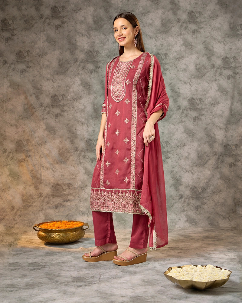 All-over zari embroidered knee-length straight kurta with 3/4 sleeves, paired with flared pants and a solid dupatta finished with lace detailing. New 1