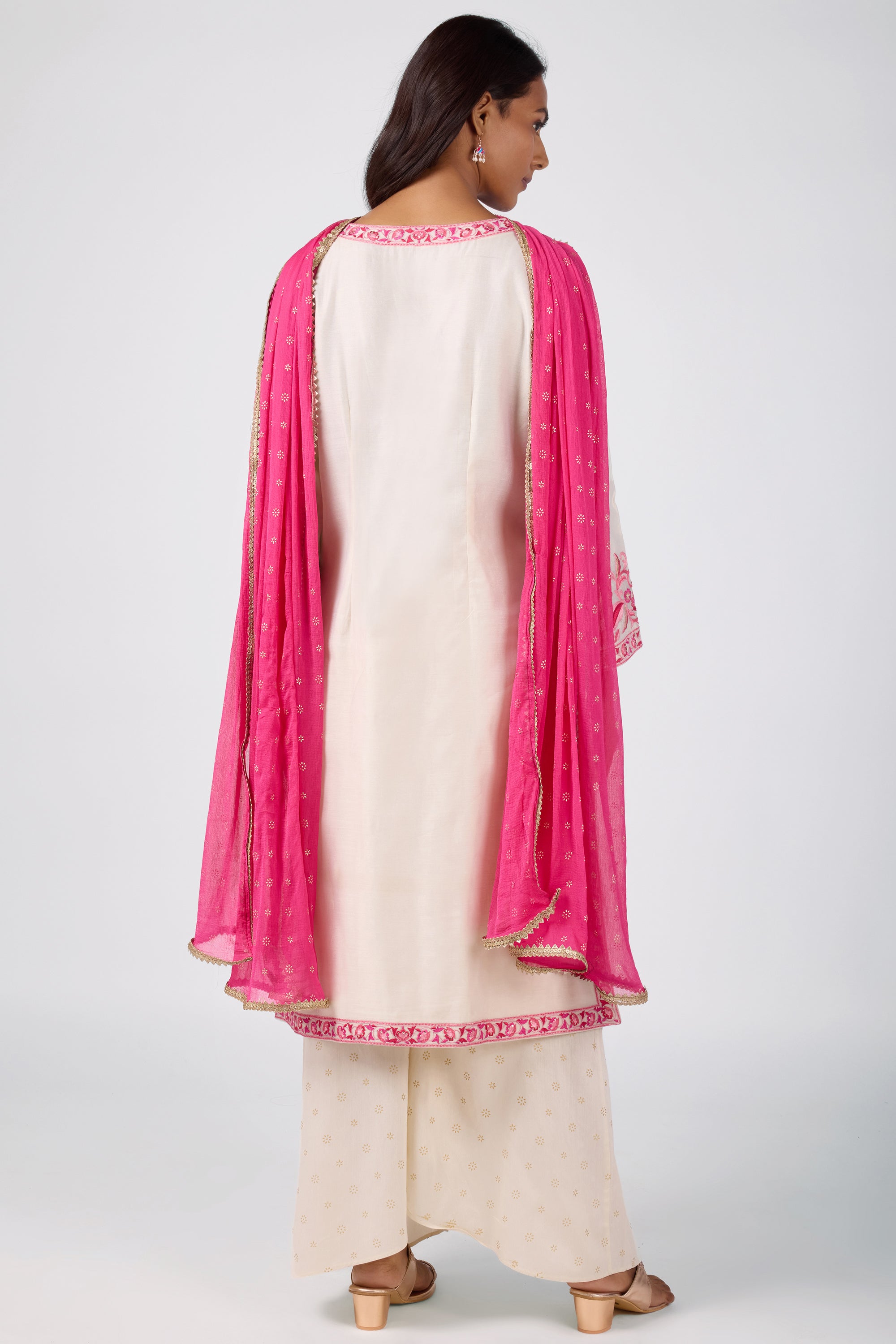A-line kurta with embroidered yoke, paired with printed bottom and dupatta.