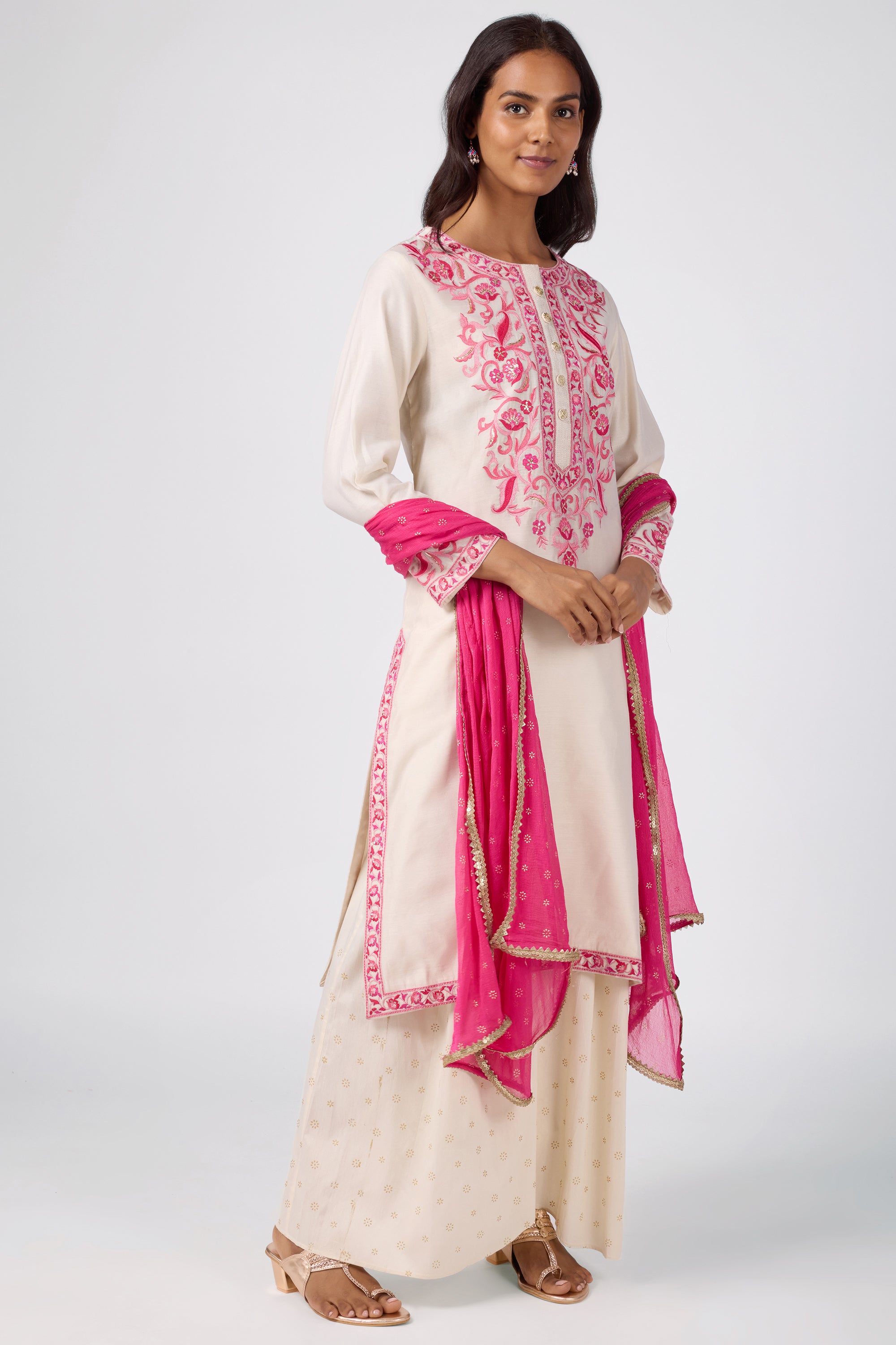 A-line kurta with embroidered yoke, paired with printed bottom and dupatta.