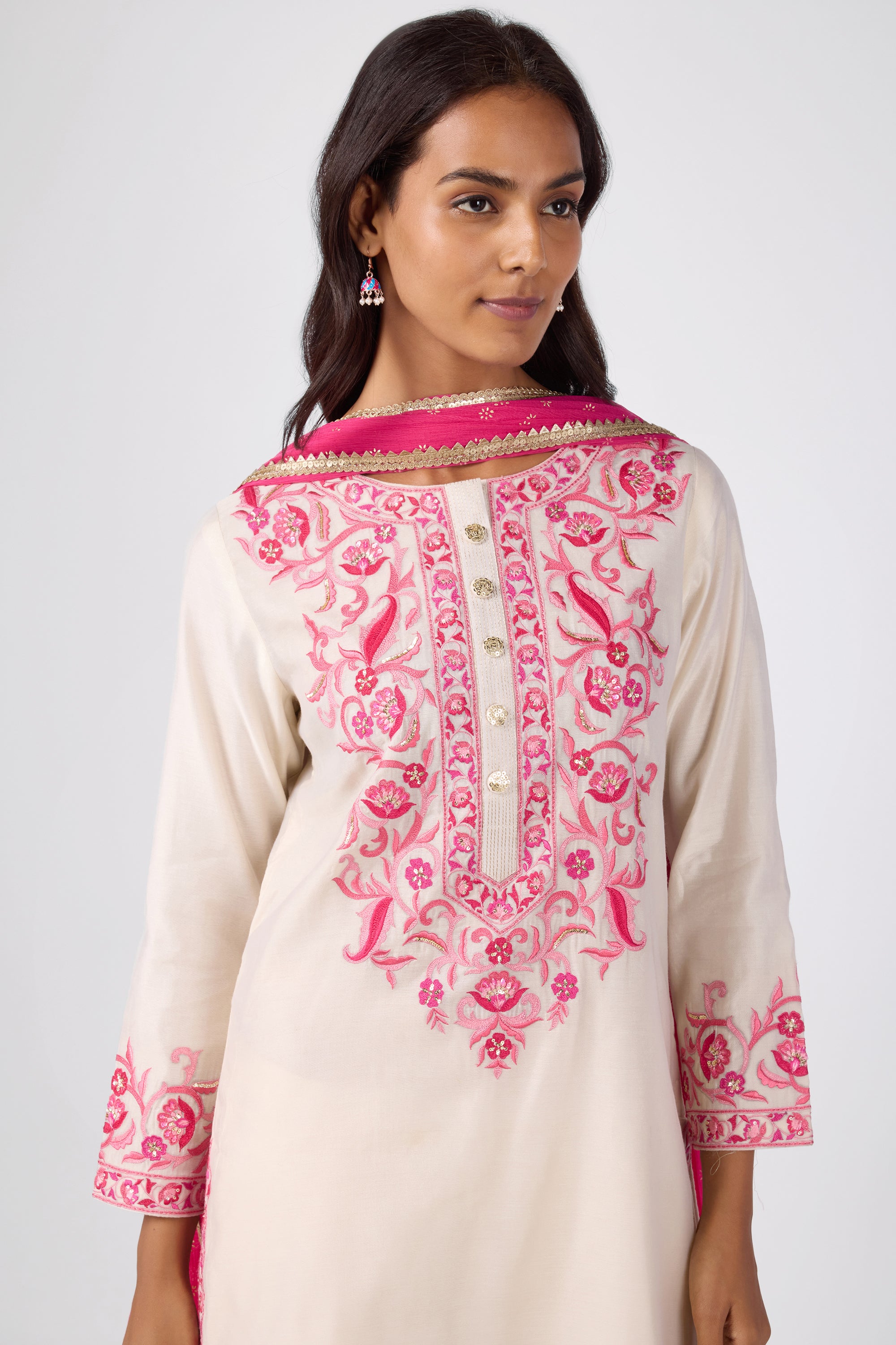A-line kurta with embroidered yoke, paired with printed bottom and dupatta.