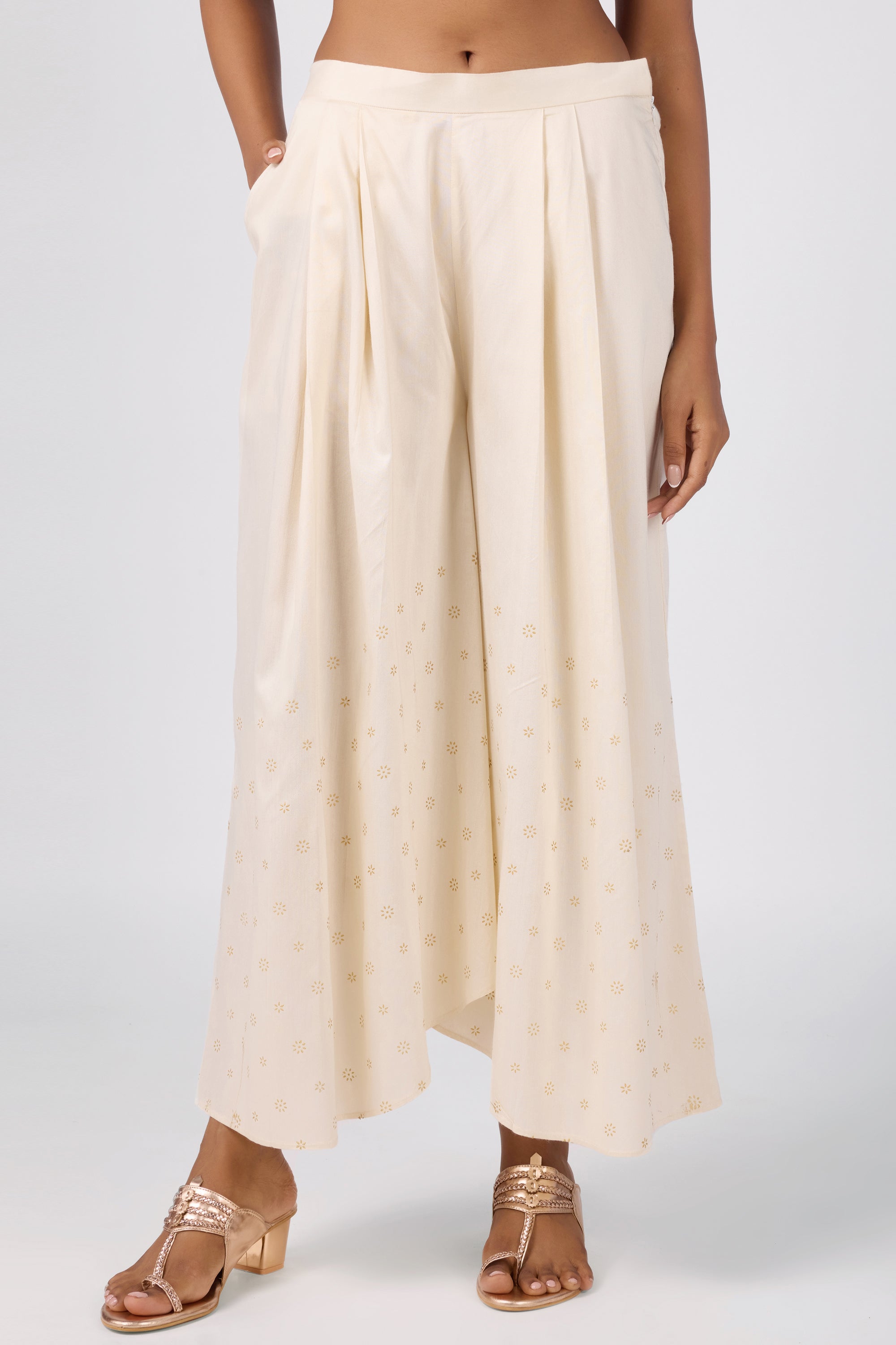 A-line kurta with embroidered yoke, paired with printed bottom and dupatta.