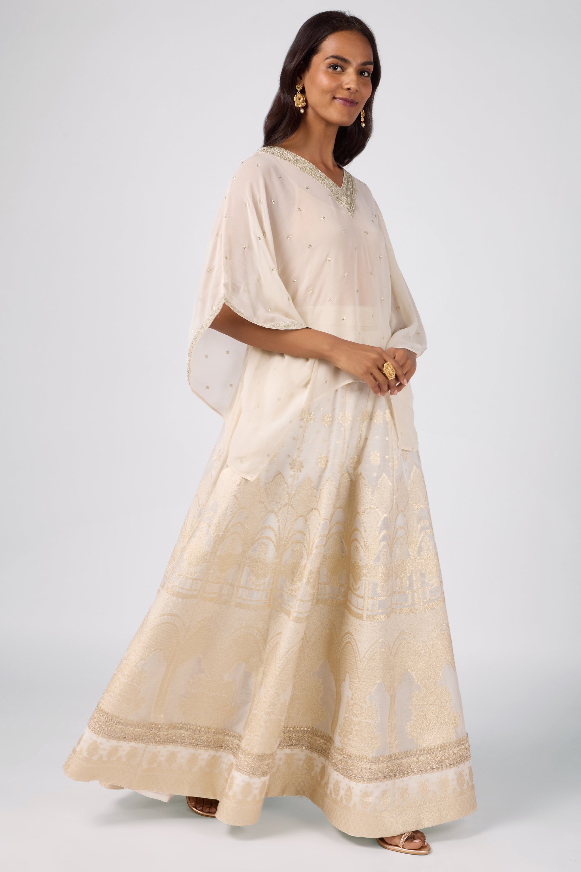 Kaftan top with delicate zari embroidery paired with a brocade skirt.
