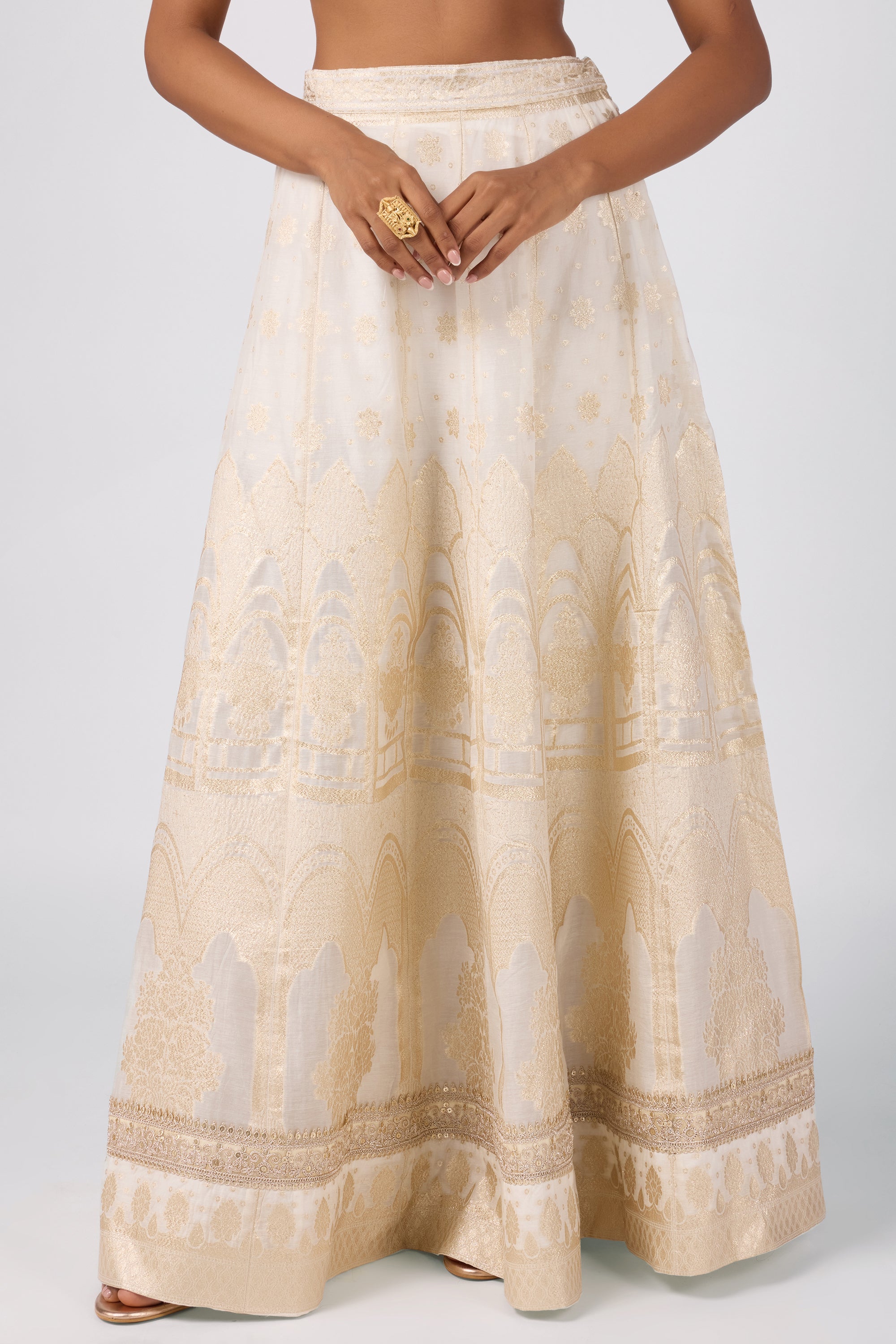 Kaftan top with delicate zari embroidery paired with a brocade skirt.